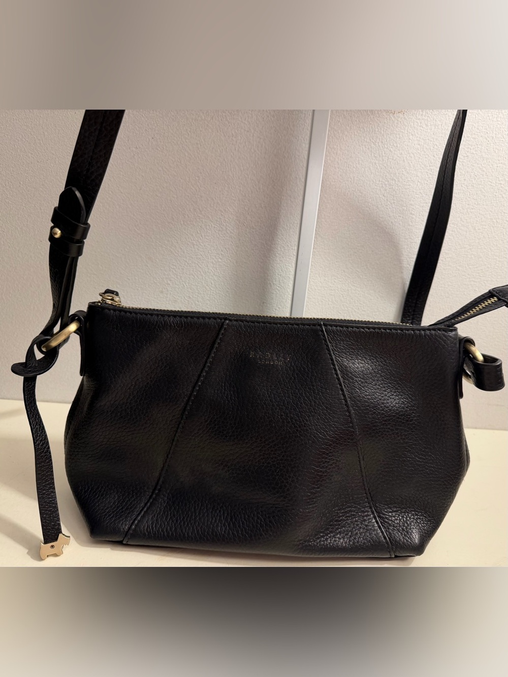 Radley London black pebbled leather crossbody.